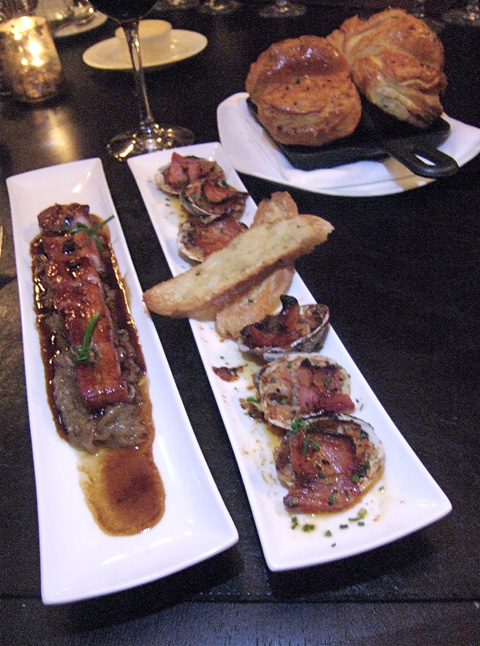 Slow roasted Berkshire bacon, clams casino and house-baked brioche are hits at our table. Photo: Steven Richter 